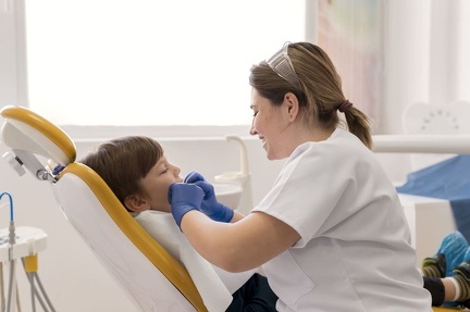 dentist-cleaning-child-s-teeth