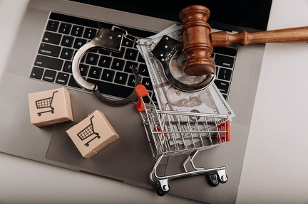 judge-gavel-handcuffs-shopping-cart-laptop-online-crime-law