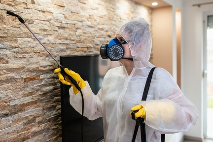 exterminator-work-wear-spraying-pesticide-with-sprayer
