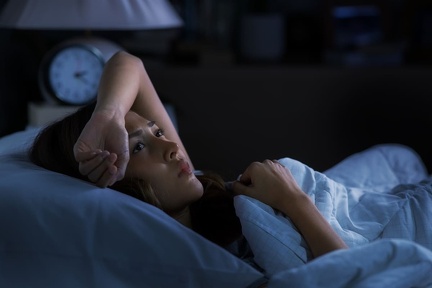 depressed-young-woman-lying-bed-cannot-sleep-from-insomnia